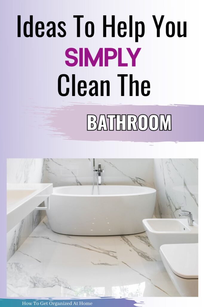  White marble bathroom with bath and toilet with the words above the image: Ideas To Help You Simply Clean The Bathroom