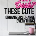 The words Tiny Desk? These Cute Organizers Change Everything are above a picture of a white minimal desk with a laptop and a pink cup with a stack of books behind.