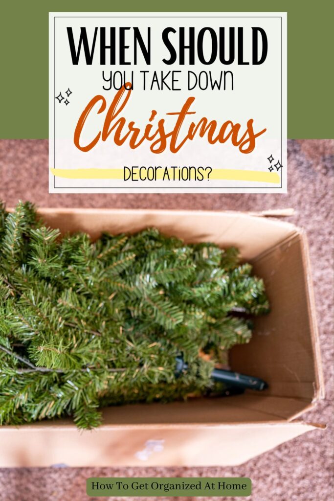 the words ‘When Should You Take Down Christmas Decorations? ‘ appear in a white box above the image of a artificial Christmas tree in a box.