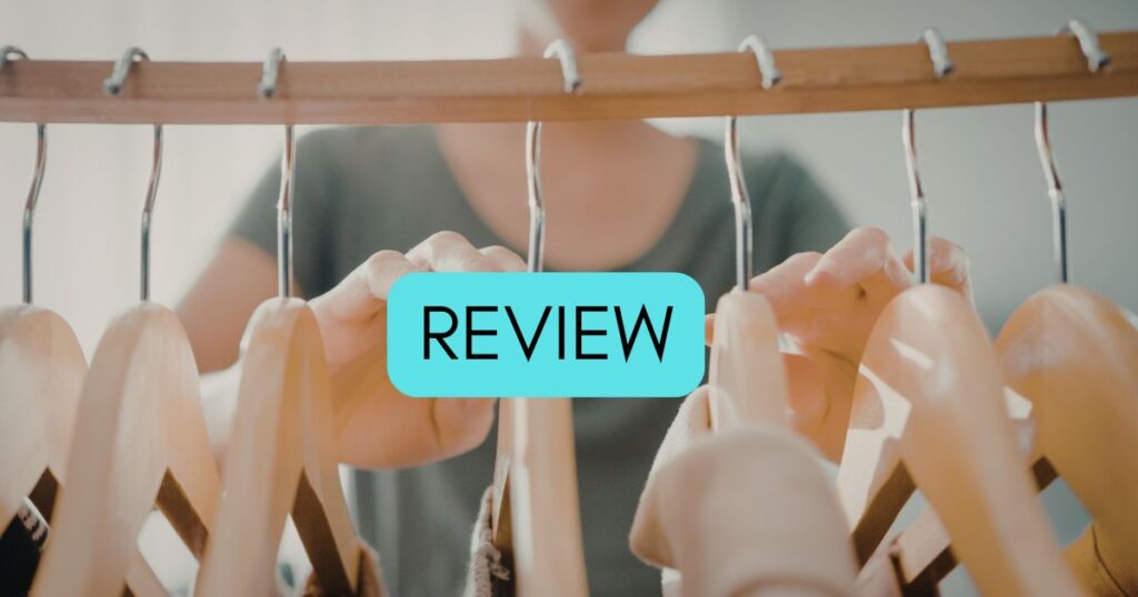 person looking at the clothes in a closet