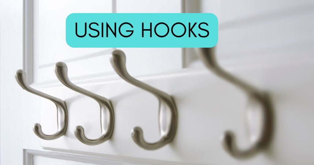 hooks on a closet door, with the words using hooks at the top of the image.