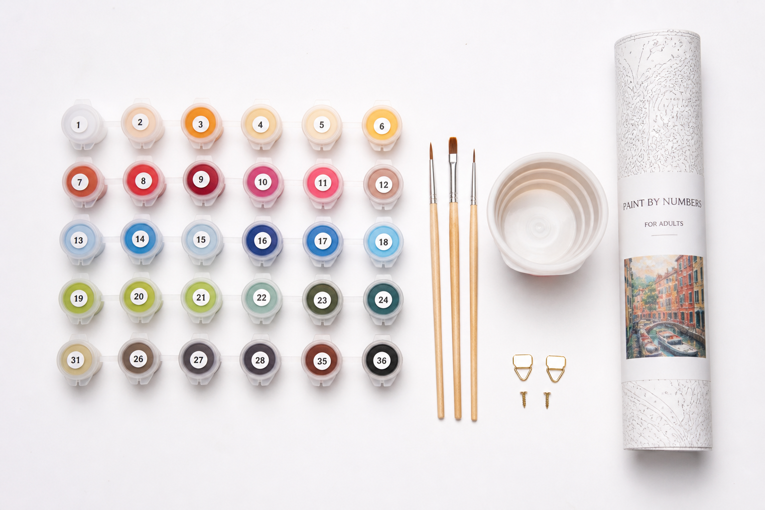 Neatly organized paint by numbers supplies including paint pots, brushes, and a protective canvas tube